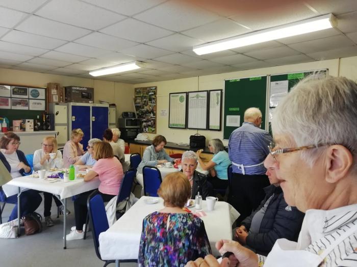 Photo of people enjoying a coffee morning at a community venue