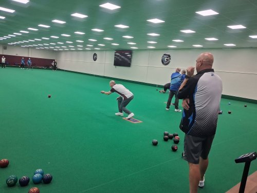 Group of people playing Bowls