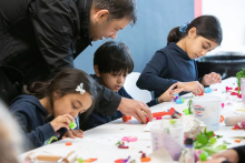 Children create art with parents 