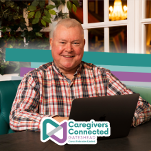 Photograph of a man enjoying volunteering as an administrator.