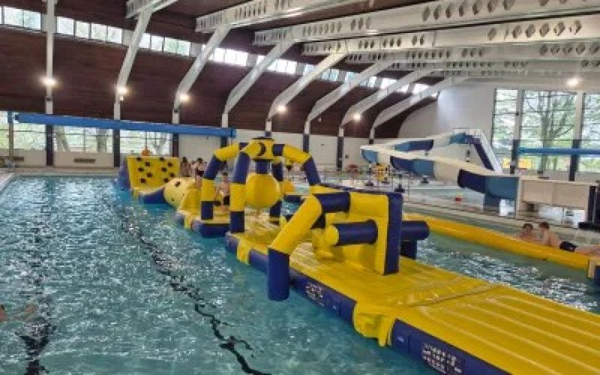 an inflatable obstacle course on a swimming pool