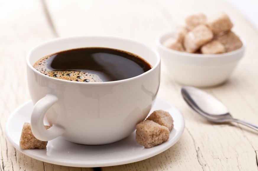 Black coffee with sugar cubes