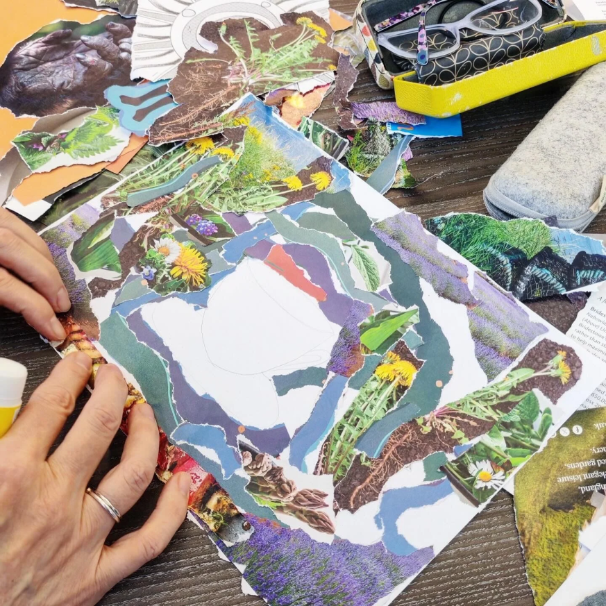 A group of people creating a collage to use in a zine making workshop