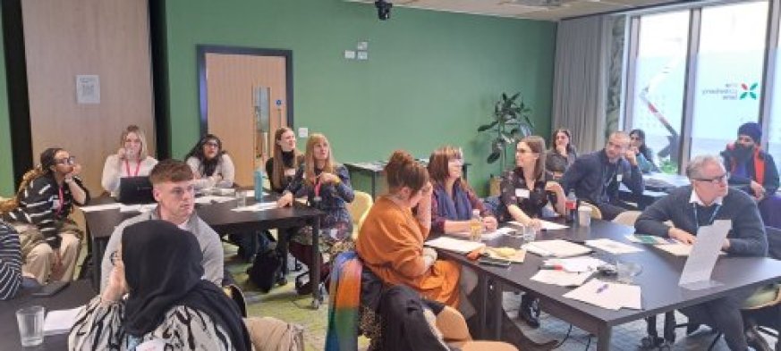 Group of people sat around a table