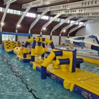 an inflatable obstacle course on a swimming pool