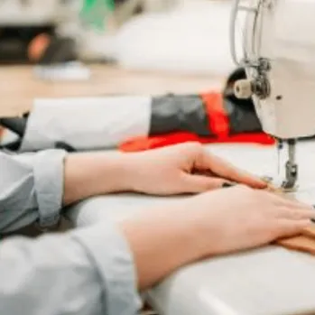 Hands on a sewing machine