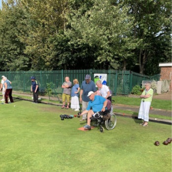 Members of Pelaw Community enjoying a game on the green. 