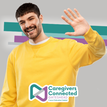 Image of a man in a yellow jumper, waving.